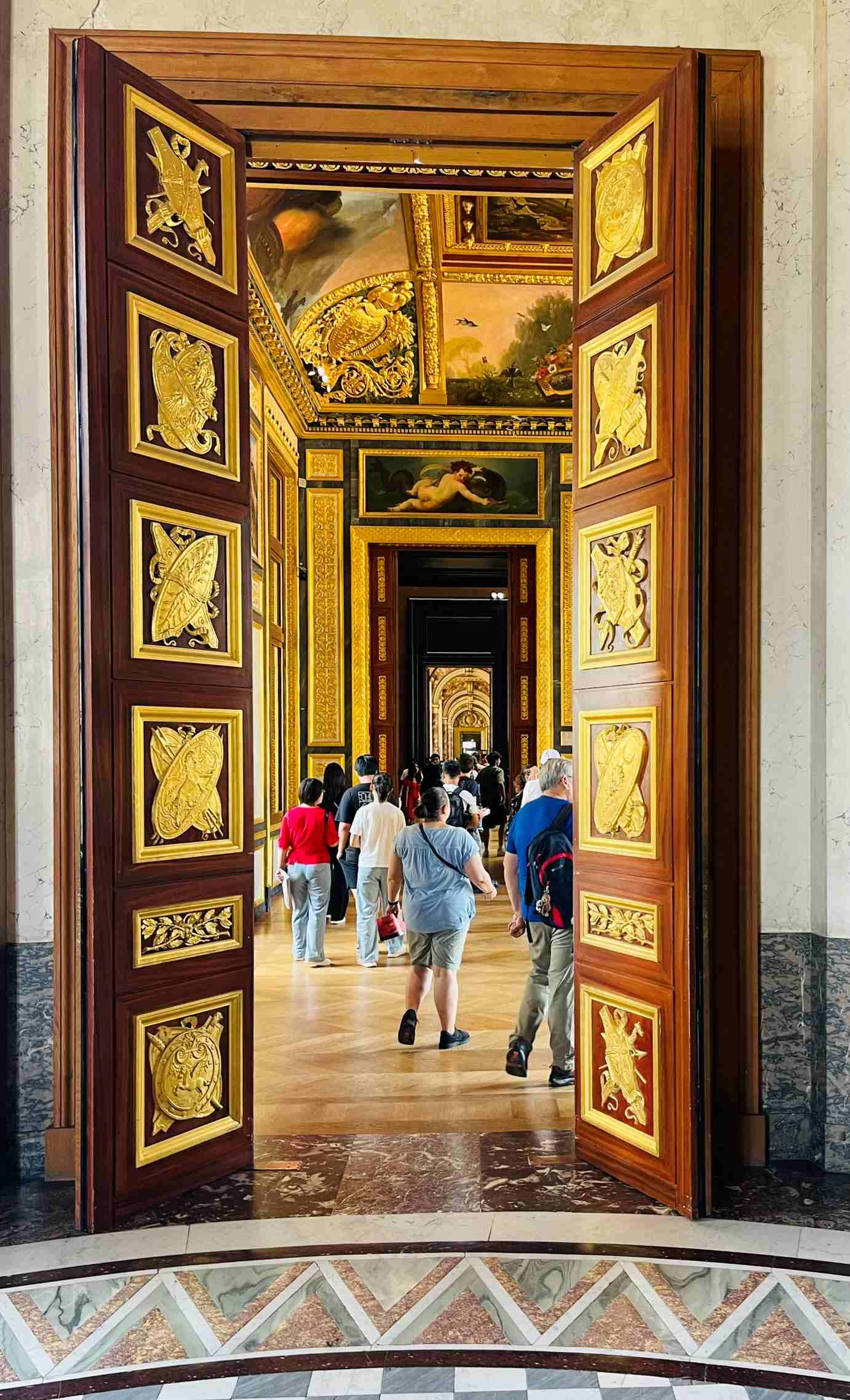 people walking in the Louvre